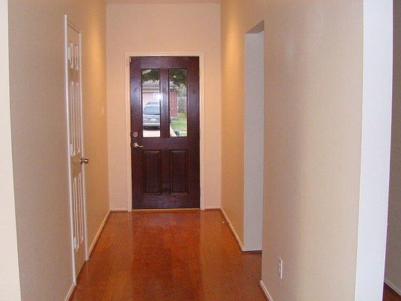 Lovely extended foyer gleams with hard wood flooring!