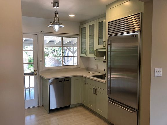 Custom kitchen - Sub-Zero refrigerator... Bosch dishwasher... Corian countertop