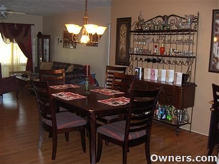Large dining room area; note laminate hardwood floors