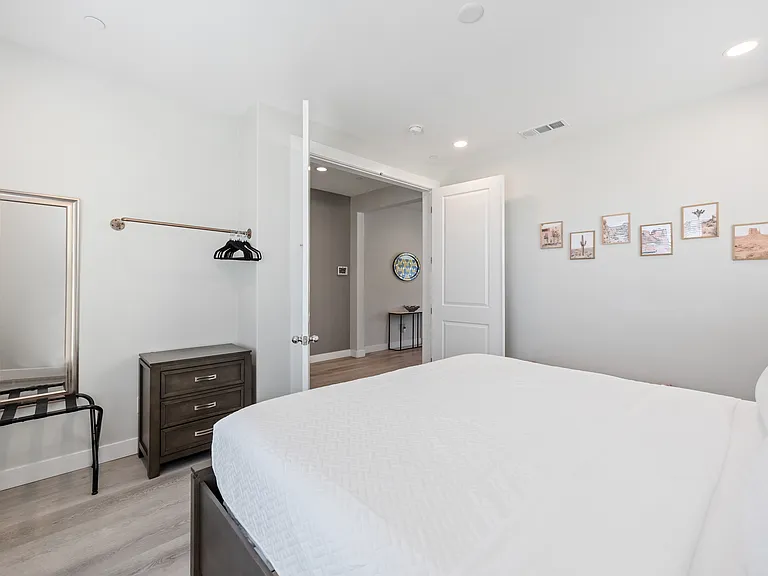 Bedroom 7 features a hanging rod for your belongings.