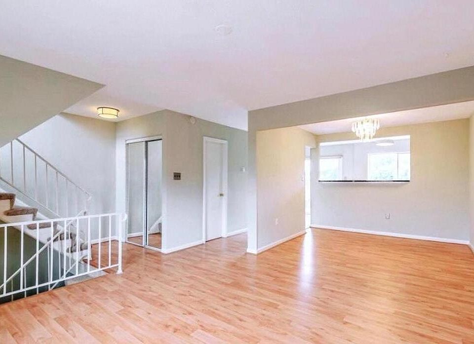 This shows the formal dining area, living room space, the half bath on the left with the mirrored closet for extra storage.