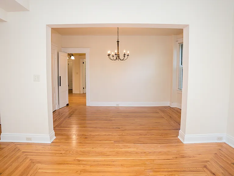 Taken from the living room, you can see the sizes of these large rooms with hardwood floors running throughout.