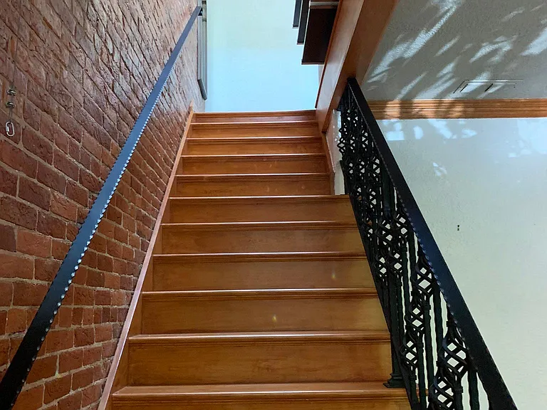 Stairs from main level to top floor