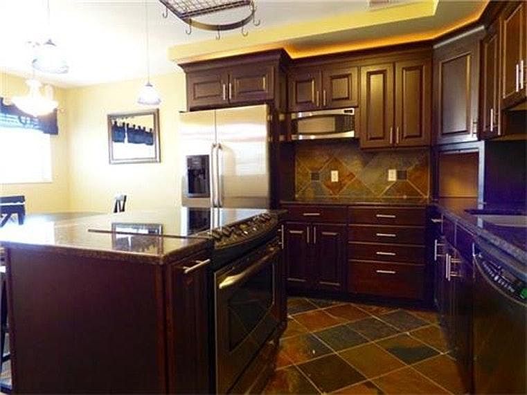 Modern cabinets and charming light fixtures