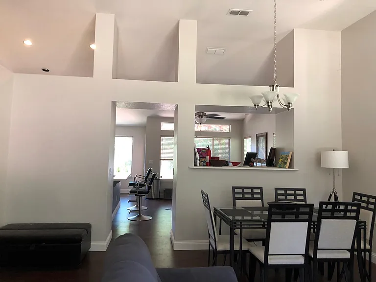 Open floor plan - dining room leading into family room and kitchen, south facing