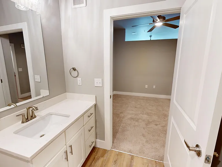 The Railyard's bathroom can be access via the bedroom or hallway, and features a spacious vanity with drawers. The Railyard's bathroom can be access via the bedroom or hallway, and features a spacious vanity with drawers.