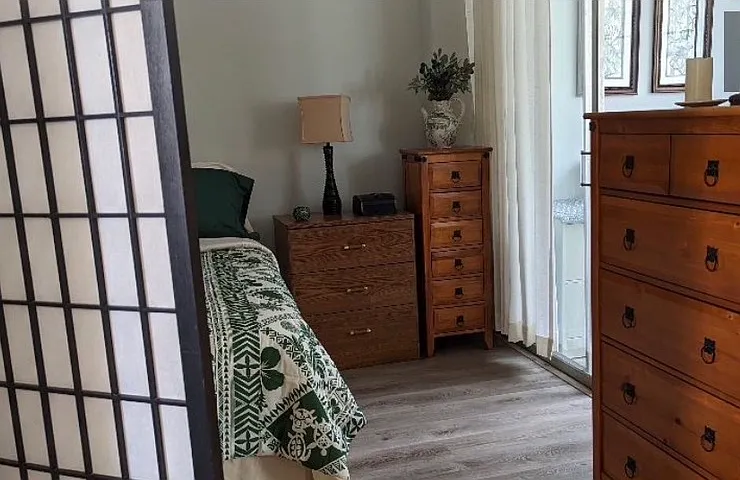 Looking in the bedroom, on right side is the other (sliding glass doors) entrance off the bedroom to the back enclosed Lanai.