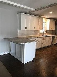 Kitchen with barnwood beam
