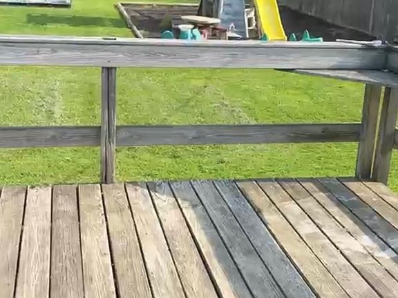fenced in large backyard and deck