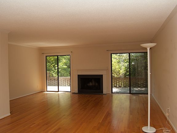 Huge livingroom with built in bookcase, fireplace, and two s