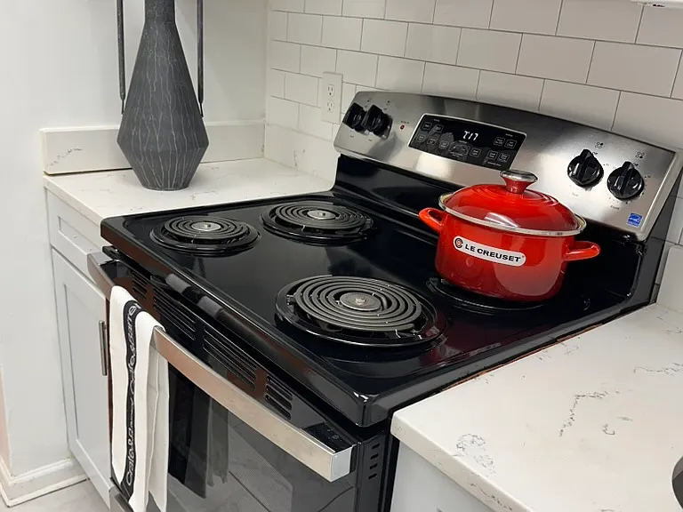 Bright, modern kitchen with brand-new stainless steel appliances,