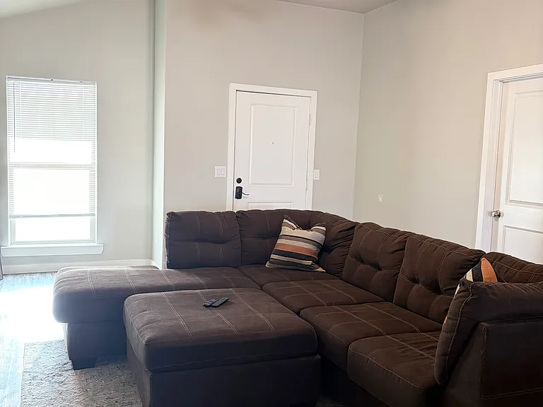 Large living room area with lots of natural light.