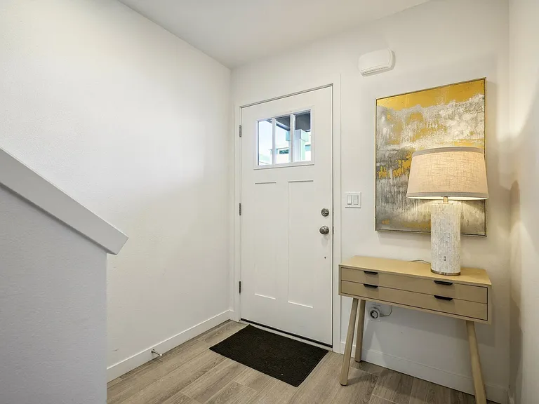 Convenient area next to front door for keys, coats,etc.