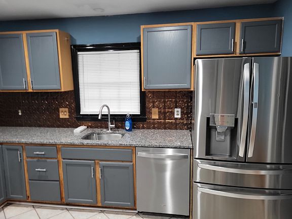 Kitchen with stainless steel appliances and granite countertops