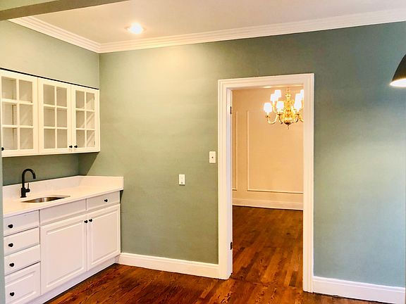 NEWLY UPDATED! Bar sink and extra cabinet storage, brand new quartz countertop, brand new faucet and sink.