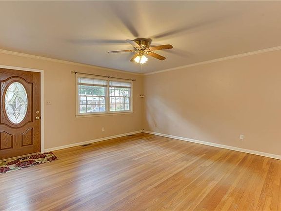 Front living area with refinished original hardwood flooring