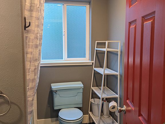 Full bath with a heated floor.