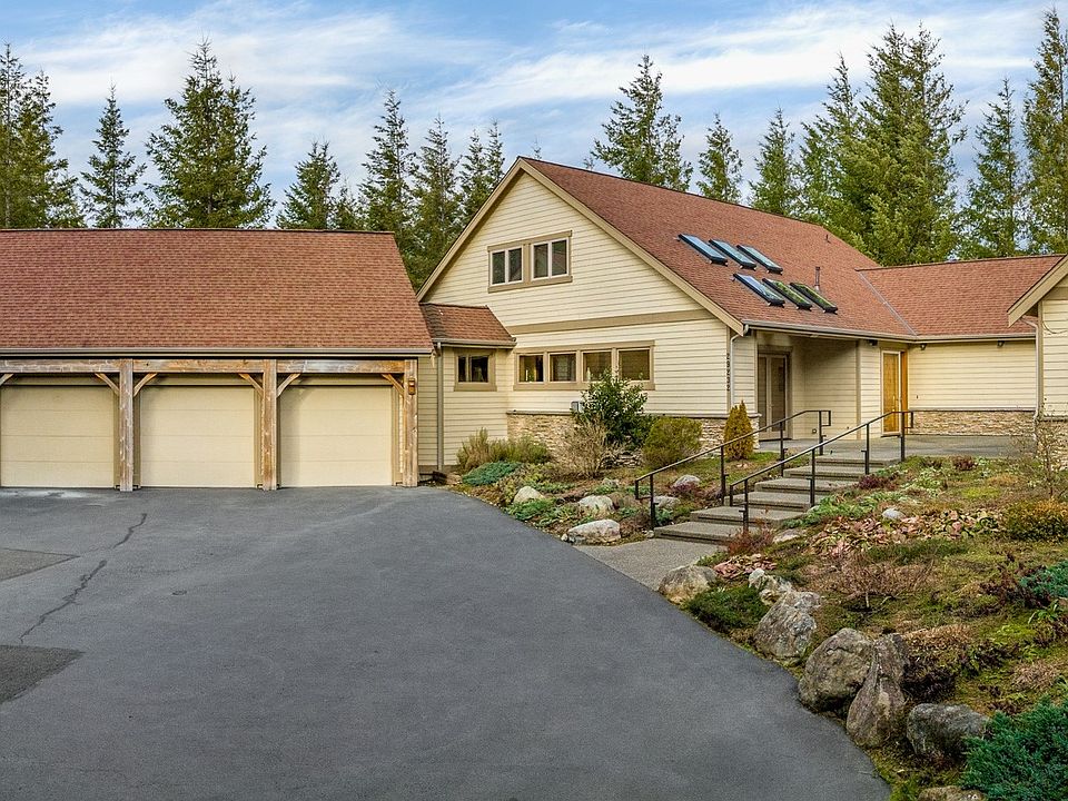 Welcome to this Northwest Lodge Style custom-built home on 5 acres of wooded serenity!>