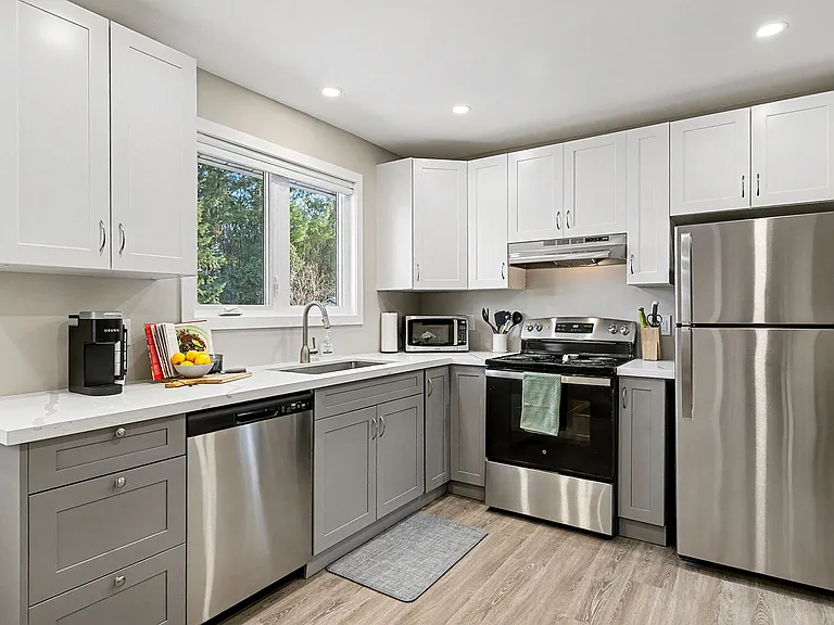 Ample counter space and modern appliances for convenient cooking in our Ottawa furnished home.