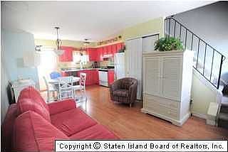 Living Room & Kitchen door to deck and cellar for storage