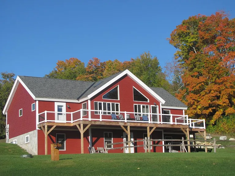 The view of the front of the home, with wrap around deck