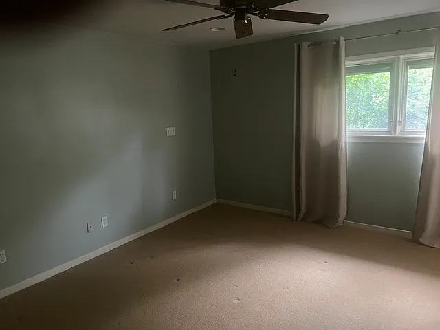 Master Bedroom. Windows face back yard.