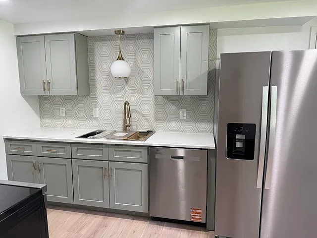 Kitchen with new dishwasher and refrigerator