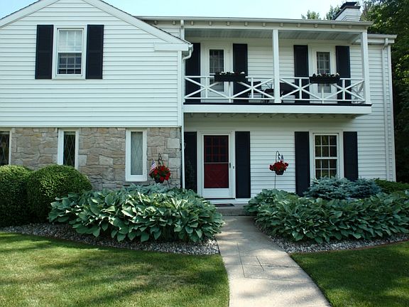 Here's a Closer look at the Front of the Home,  Notice the Quaint  Balcony Above the Front Door.