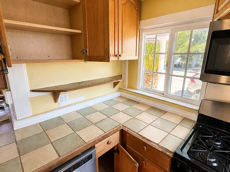 Kitchen with gas range and ample counter space