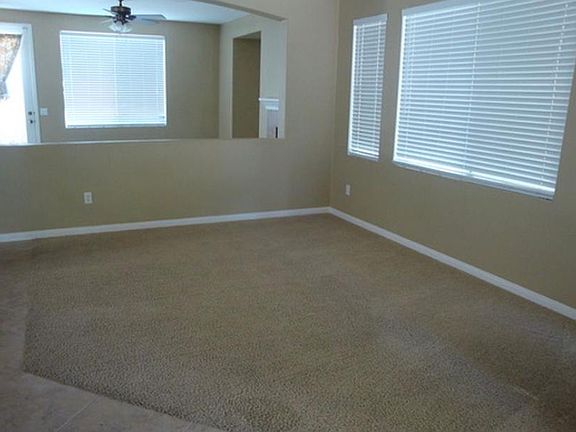 Formal living space, across from formal dining space, connected to informal living and kitchen - downstairs bathroom with sink and toilet too