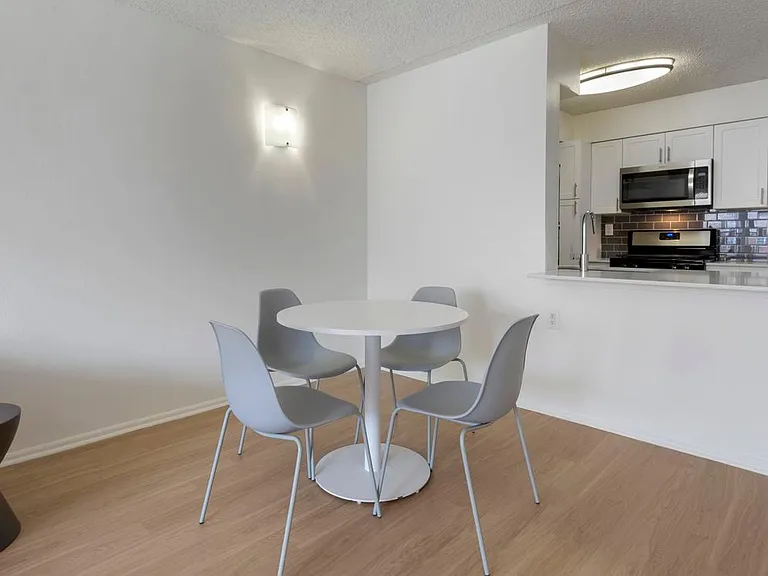 Furnished+ apartment homes include a dining set (Representative Image exact items and style of furnishings may vary)