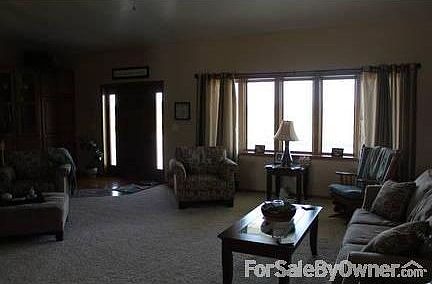 ENTRY/LIVING ROOM
						:
						WOOD ENTRY AND NEUTRAL CARPET