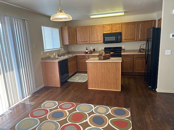 kitchen with island and dinning are with walkout to deck