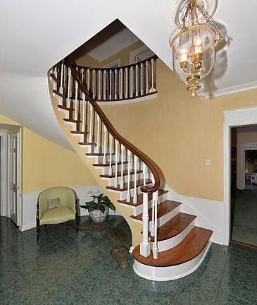 Large entry foyer with ceramic tile leading to formal Living Room, Formal Dining Room, and cozy Den.