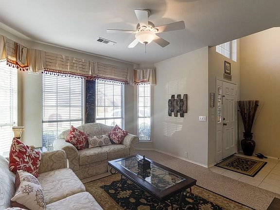 Formal dining area currently serves as second living area downstairs.