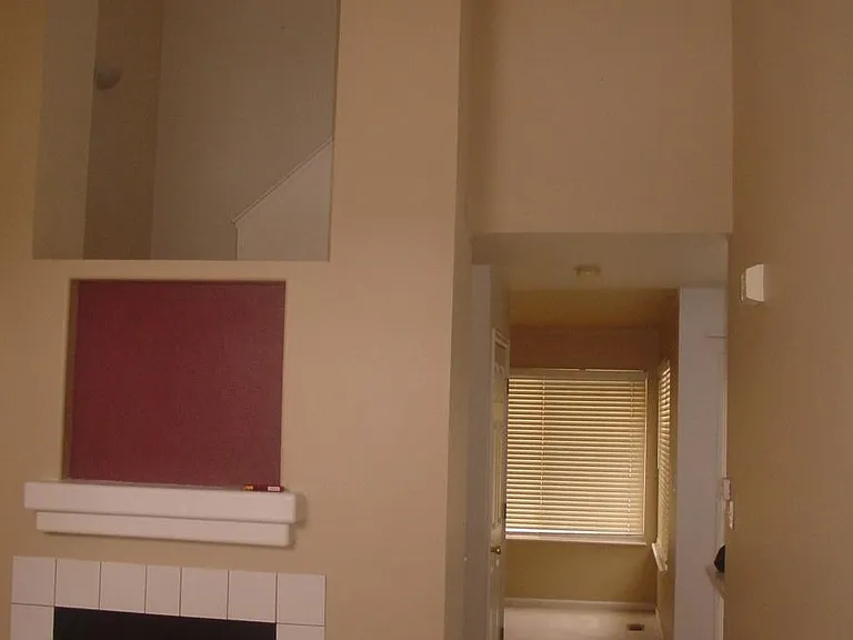 Living room, fireplace and vaulted ceiling