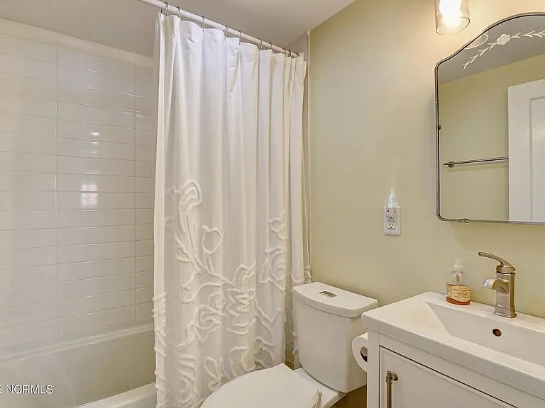Renovated bath with tiled shower