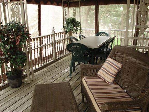 Oasis style screened in room on large deck