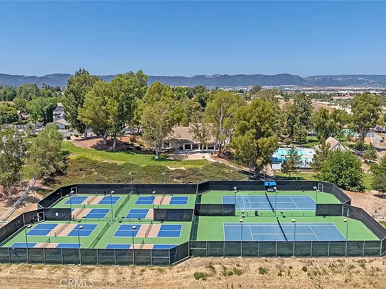 Enjoy tennis a 5 minute bike ride away. :)