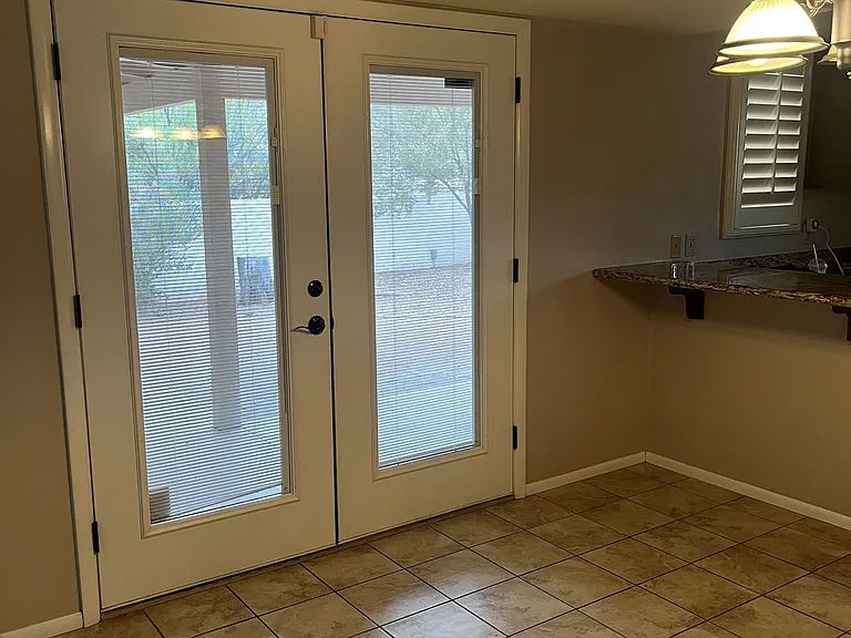 dining area with french doors to back yard
