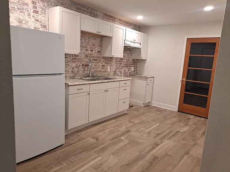 Kitchen with door leading outside