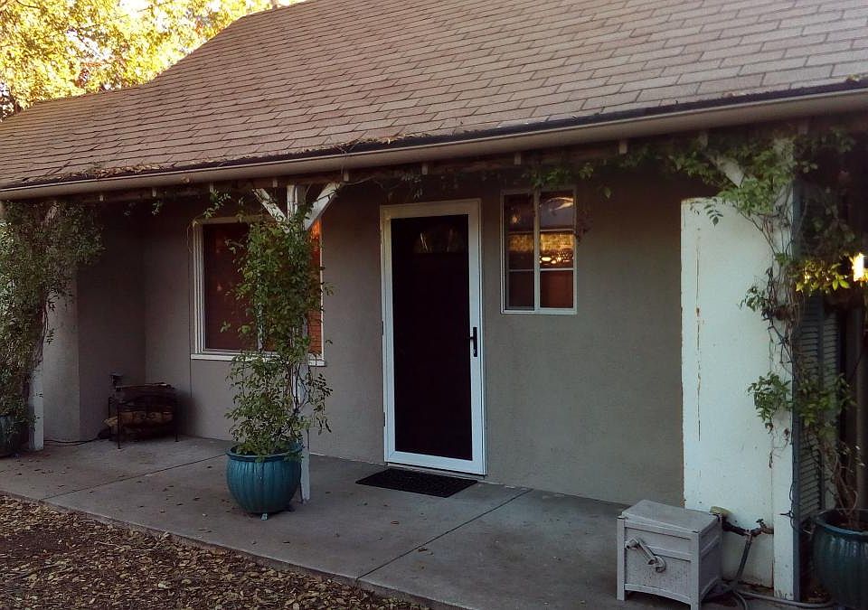 Private entrance with security screen door.