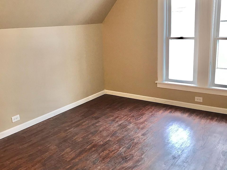 Spacious lounge room streaming with natural sunlight - has charming character.