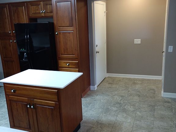 Kitchen has movable island 