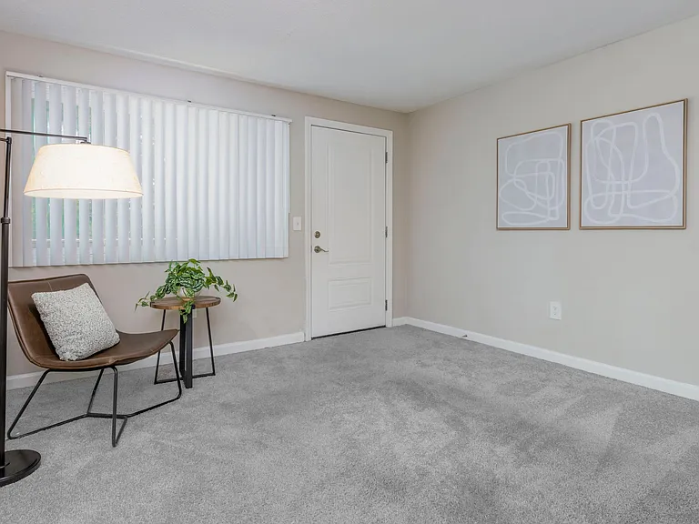 Discover cozy perfection in your apartment living experience. Living rooms offer plush carpeting, adjustable blinds, and a picturesque window making your apartment a dream come true.