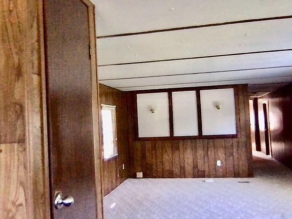 Hallway on right to the two bedrooms, bathroom and mudroom as well as basement/garage access.