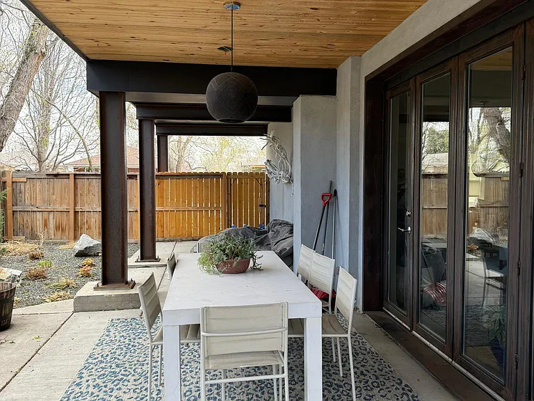 Amazing patio area on ground floor, just off kitchen. The glass doors are three panels that fold to create indoor/outdoor space.