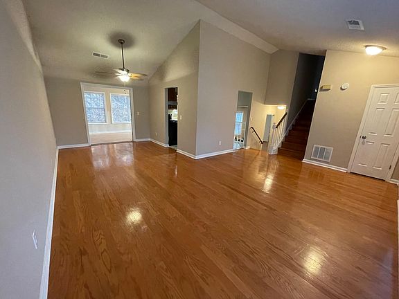 Living room looking left to dining room and in to sun room. Looking right foyer with closet and stirs up to the bedrooms and down to the den, laundry and garage. Kitchen is central and accessible from two sides. Love these floors.