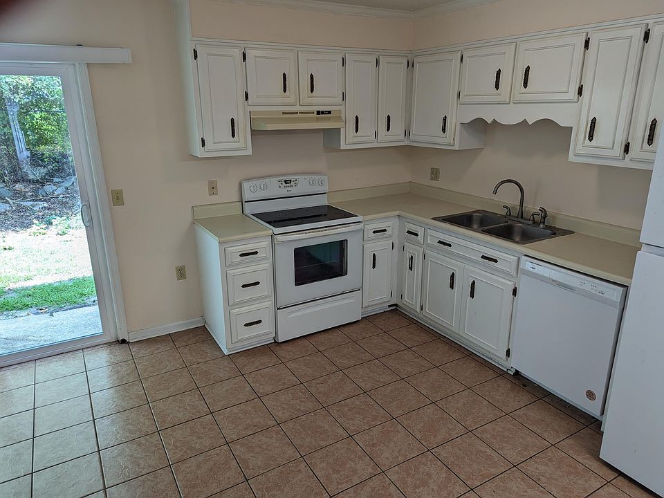 1st floor - kitchen with appliances and new patio door.