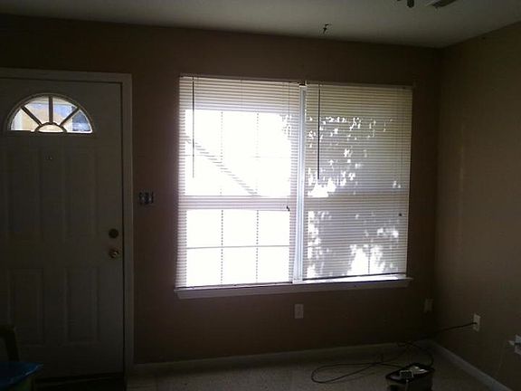 living room looking out to parking lot